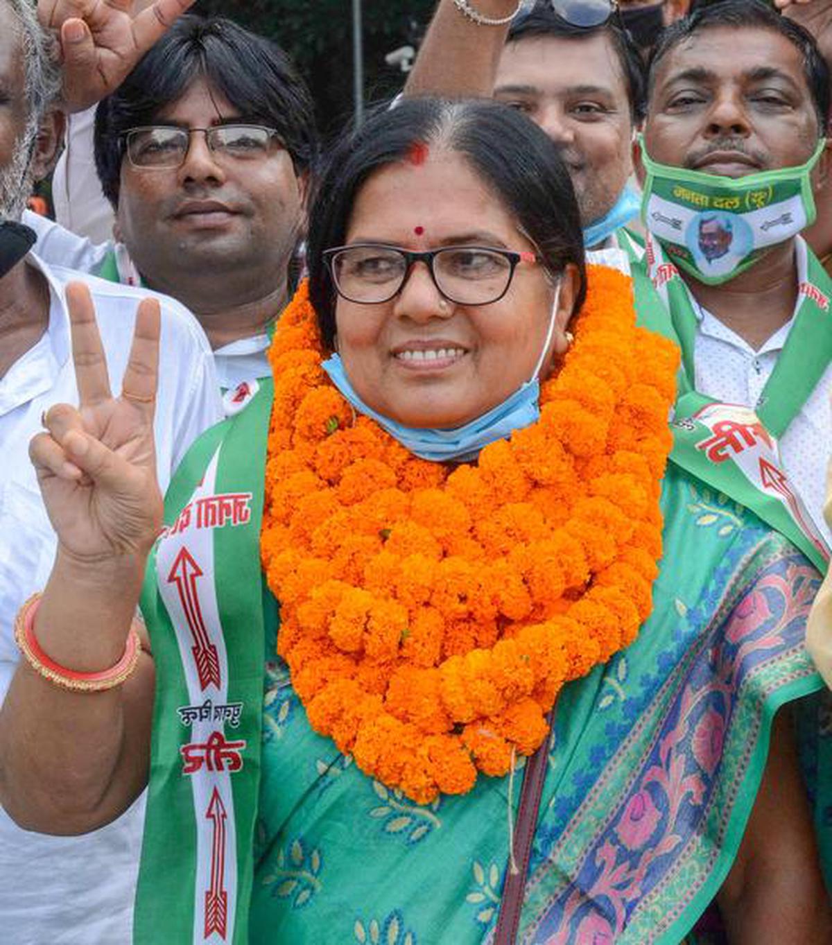 Manju Verma flashes the victory sign after being nominated as a candidate of JD(U) party for the upcoming Bihar State Assembly elections, in Patna, Thursday, Oct. 8, 2020.