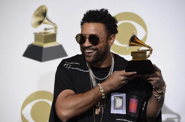 Shaggy poses in the press room with the award for best reggae album for "44/876"