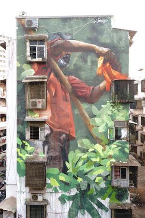 Wall flowers: Canadian street artist, Young Jarus (Emmanuel Jarus), painted his first artwork in the country, across a building in Mahim East.