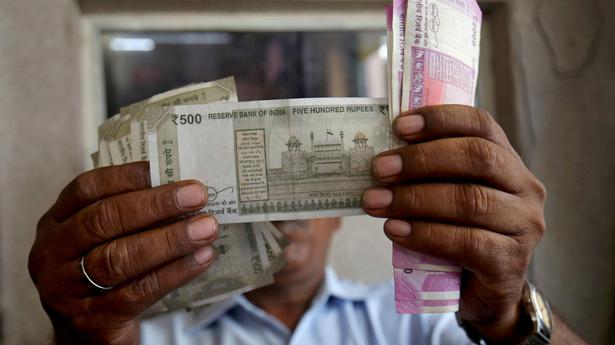 Rupee plummets 57 paise to close at 76.92 against U.S. dollar