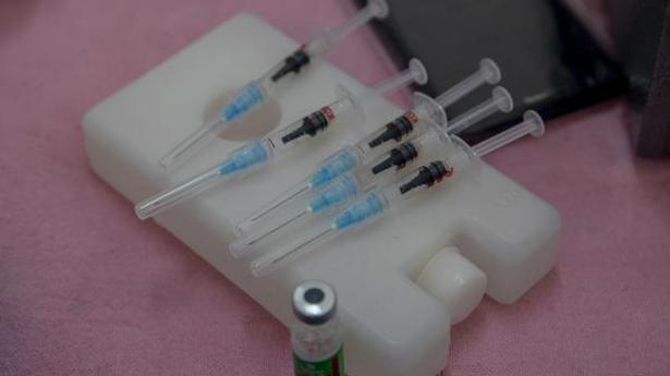   Syringes filled with Covishield lie on an ice box at a primary health centre in Srinagar on April 28, 2021. 