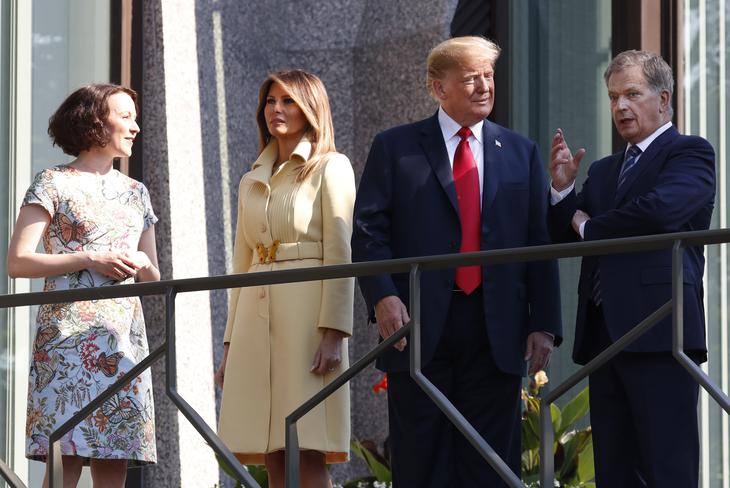 Jenni Haukio, wife of Finnish President Sauli Niinisto, U.S. First Lady Melania Trump, U.S. President Donald Trump and Finnish President Sauli Niinisto, from left, pose for a photographer of the balcony of Niinisto's official residence in Helsinki, Finland, Monday, July 16, 2018 prior to his meeting with Russian President Vladimir Putin in the Finnish capital.