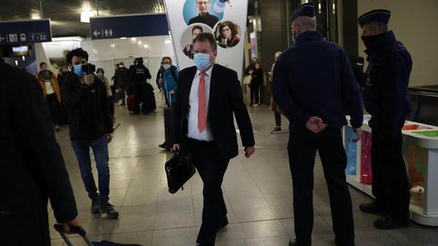 Britain's chief negotiator David Frost (centre) wears a protective face mask as he arrives in Brussels for Brexit talks with EU chief negotiator Michel Barnier on December 6, 2020.