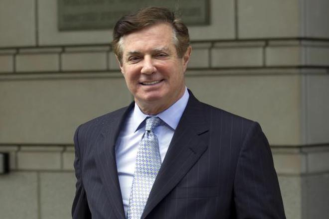 In this May 23, 2018, file photo, Paul Manafort, President Donald Trump's former campaign chairman, leaves the Federal District Court after a hearing, in Washington. Special counsel Robert Mueller is accusing Manafort of lying to federal investigators in the Russia probe in breach of his plea agreement.