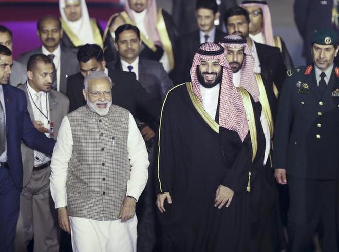 Saudi Arabia's Crown Prince Mohammed bin Salman is received by Prime Minister Narendra Modi at the airport in New Delhi on Tuesday.