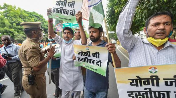   Congress party workers stage a protest, demanding the transfer of Hathras district Magistrate Praveen Kumar Laxkar on October 4, 2020. 